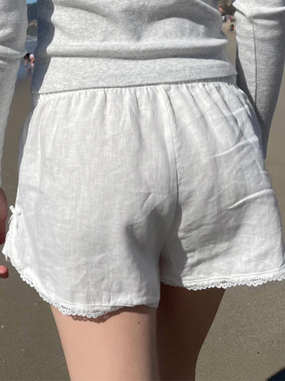 Holiday style buttoned solid color elastic waist loose versatile stitching lace casual pants